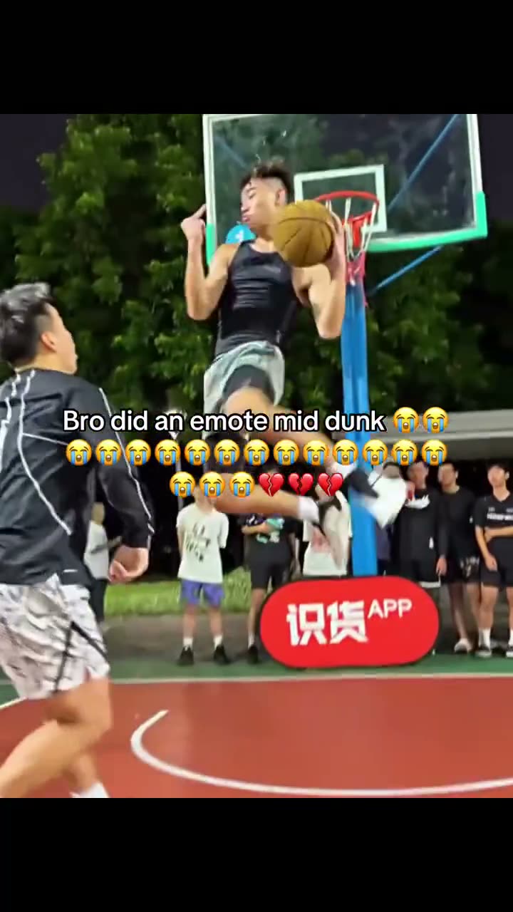 The streetball clip that started it: a player hanging on the rim over his defender
